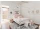 Bright bedroom showcasing a four-poster bed, stylish rug, and a sunny window at 238 Olympic Pl, Decatur, GA 30030