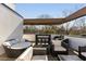 Contemporary rooftop deck with stylish lounge furniture and outdoor bar area at 238 Olympic Pl, Decatur, GA 30030