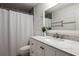 Well-lit bathroom featuring a marble counter top, brushed nickel faucet, and modern finishes at 2886 Salmon Se Ave, Atlanta, GA 30317