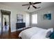 Comfortable bedroom with hardwood floors, ceiling fan, and soft grey wall color at 2886 Salmon Se Ave, Atlanta, GA 30317