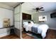 Stylish bedroom featuring frosted sliding doors and a comfortable bed with decorative pillows at 2886 Salmon Se Ave, Atlanta, GA 30317