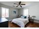 Sunlit bedroom with hardwood floors, ceiling fan, and contemporary decor at 2886 Salmon Se Ave, Atlanta, GA 30317