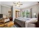 Bedroom with hardwood floors, ceiling fan and a queen sized bed next to a set of French doors at 698 Bellemeade Nw Ave, Atlanta, GA 30318