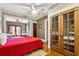 Bedroom with hardwood floors and access to a sunroom through red French doors at 698 Bellemeade Nw Ave, Atlanta, GA 30318