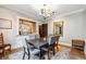 Elegant dining room featuring a large table, seating for six, and hardwood floors at 698 Bellemeade Nw Ave, Atlanta, GA 30318