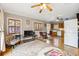 Inviting living room with hardwood floors, a ceiling fan, and an open layout to the kitchen at 698 Bellemeade Nw Ave, Atlanta, GA 30318