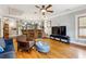 Open-concept living room with a bar, hardwood floors, and comfortable seating at 698 Bellemeade Nw Ave, Atlanta, GA 30318