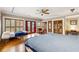 Bright main bedroom with hardwood floors, plantation shutters, and access to a private balcony at 698 Bellemeade Nw Ave, Atlanta, GA 30318