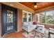 Cozy sunroom with brick accents, comfortable seating, and plenty of natural light for relaxing at 698 Bellemeade Nw Ave, Atlanta, GA 30318