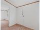 Bright entryway featuring neutral carpeting, white walls, and view into another room at 95 Riverbrooke Trl, Covington, GA 30016