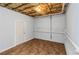 Unfinished basement featuring concrete walls, pipes along the ceiling, and tile flooring at 97 Spring Leaf Dr, Dallas, GA 30157