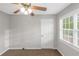 This carpeted bedroom features a ceiling fan and window with blinds at 97 Spring Leaf Dr, Dallas, GA 30157