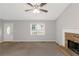 Inviting living room features a brick fireplace, entry door and large window at 97 Spring Leaf Dr, Dallas, GA 30157