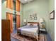 Comfortable bedroom with light green walls and a ceiling fan above the bed at 138 Kirkwood Ne Rd # 9, Atlanta, GA 30317