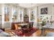 Sunlit dining room with large windows, hardwood floors, and elegant decor at 138 Kirkwood Ne Rd # 9, Atlanta, GA 30317