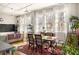Open dining area with hardwood floors, large windows, and stylish furniture at 138 Kirkwood Ne Rd # 9, Atlanta, GA 30317