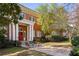 View of a classic brick apartment building with well-manicured landscaping and a welcoming outdoor seating area at 138 Kirkwood Ne Rd # 9, Atlanta, GA 30317