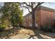Brick apartment building with large trees providing shade on the lawn at 138 Kirkwood Ne Rd # 9, Atlanta, GA 30317