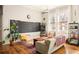 Cozy living room with bright sunlight and a decorative chalkboard at 138 Kirkwood Ne Rd # 9, Atlanta, GA 30317