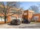 Brick building with ample parking space, highlighting its convenient location and accessibility at 138 Kirkwood Ne Rd # 9, Atlanta, GA 30317