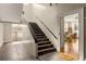 Classic staircase with metal railings leading to the upper level and hardwood floors at 138 Kirkwood Ne Rd # 9, Atlanta, GA 30317