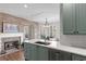 Kitchen featuring a breakfast nook, quartz countertop and a brick fireplace at 313 Calla Ln, Alpharetta, GA 30005