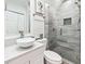 Bathroom featuring a vessel sink, tile shower, and modern fixtures at 3353 Old Oaks Rd, Buford, GA 30519