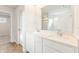 Bright bathroom with double vanity and open view to additional bath amenities at 4155 Viola Pl, Atlanta, GA 30349