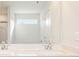 Bright bathroom featuring a double sink vanity at 4155 Viola Pl, Atlanta, GA 30349