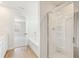 Bright bathroom featuring shower, bathtub and tile floors at 4155 Viola Pl, Atlanta, GA 30349