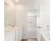 Bright bathroom with double sink vanity and bathtub at 4155 Viola Pl, Atlanta, GA 30349