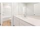 Bathroom featuring modern vanity with white countertop and a tub with shower at 4155 Viola Pl, Atlanta, GA 30349