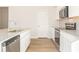 Well-lit kitchen with stainless steel appliances, granite countertops, and wood-look flooring at 4155 Viola Pl, Atlanta, GA 30349