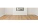 Bright living room showcasing wood-look flooring and a modern fireplace with white shiplap at 4155 Viola Pl, Atlanta, GA 30349
