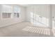Well-lit carpeted bedroom with large windows and ample closet space at 5530 Rosehall Pl, Atlanta, GA 30349