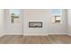 Stylish living room featuring wood-look floors and a modern electric fireplace at 5530 Rosehall Pl, Atlanta, GA 30349