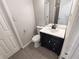 Bathroom features a modern vanity with a stone countertop and tile floors at 3230 Jamaica Nw Rd, Atlanta, GA 30318