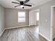 Bedroom with laminate floors, natural light, and a ceiling fan at 3230 Jamaica Nw Rd, Atlanta, GA 30318