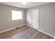 Bedroom featuring laminate floors, natural light, and neutral walls at 3230 Jamaica Nw Rd, Atlanta, GA 30318