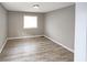 Bedroom featuring laminate floors, natural light, and neutral walls at 3230 Jamaica Nw Rd, Atlanta, GA 30318