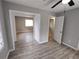 Spacious bedroom with vinyl floors and multiple doorways, offering flexibility and modern design at 3230 Jamaica Nw Rd, Atlanta, GA 30318