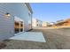 Backyard with a concrete patio and gray siding on the house at 4163 Viola Pl, Atlanta, GA 30349