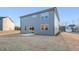 Backyard with a concrete patio and gray siding on the two story house at 4163 Viola Pl, Atlanta, GA 30349