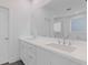 Bathroom featuring a double sink vanity with quartz countertop and a large mirror at 482 Hammons Way, Atlanta, GA 30315