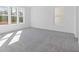 Bright bedroom with large windows and soft carpet flooring at 482 Hammons Way, Atlanta, GA 30315