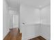 Hallway with white walls and wood floors, leading to other rooms in the house at 482 Hammons Way, Atlanta, GA 30315