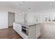 Spacious kitchen island featuring built in microwave and stone countertops at 482 Hammons Way, Atlanta, GA 30315