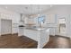 Spacious kitchen with large island, stainless steel appliances, and white cabinetry at 482 Hammons Way, Atlanta, GA 30315