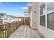 A wooden deck overlooking the backyard provides an outdoor space for relaxing and entertaining at 6080 Indian Wood Se Cir, Mableton, GA 30126