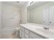 Bright bathroom with a large mirror, white cabinets, and a shower-tub combo at 6080 Indian Wood Se Cir, Mableton, GA 30126